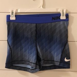 Blue and black nike pros